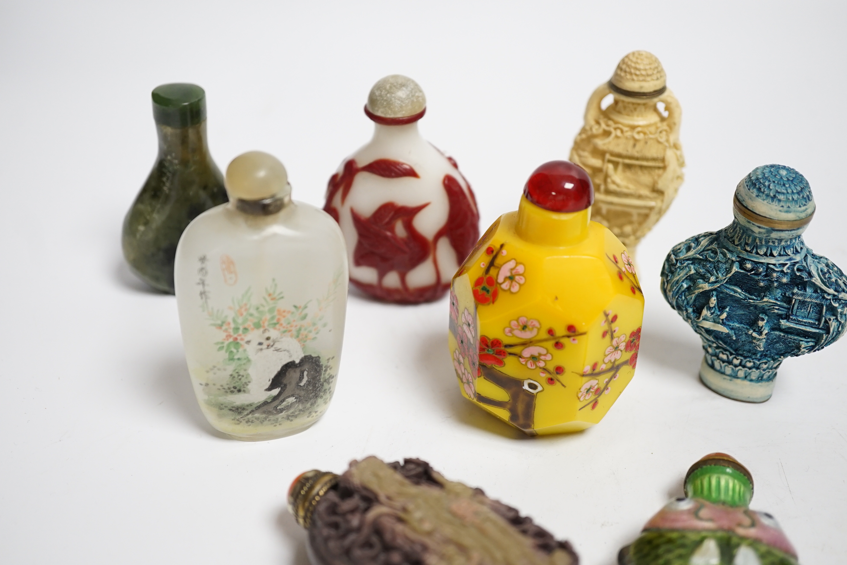 Seven various Chinese snuff bottles to include enamel, resin, agate, ceramic and glass